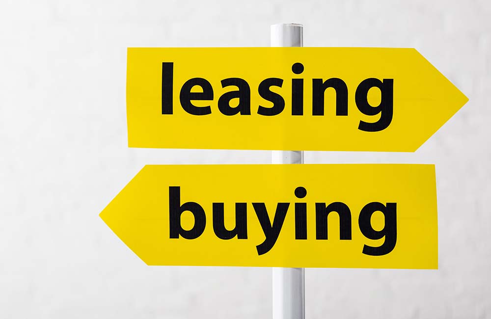 lease or buy road sign